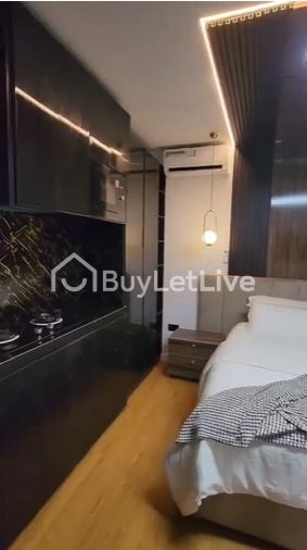 Aisha luxury studio apartment with bathtub and PS5 console.